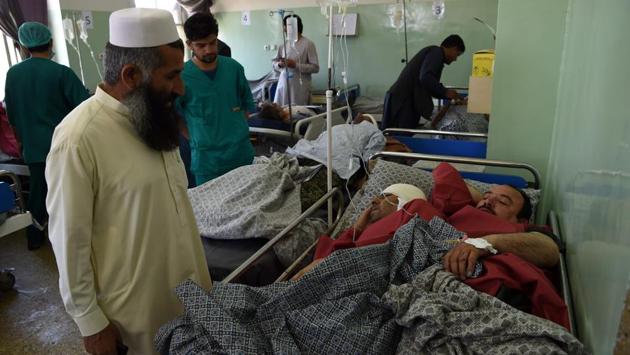 Afghan residents wounded in a car bomb attack receive treatment at a hospital in Kabul. (WAKIL KOHSAR / AFP)