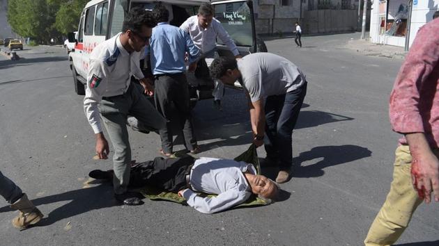 Bodies littered the scene and a huge plume of smoke rose from the area which houses foreign embassies. (SHAH MARAI / AFP)