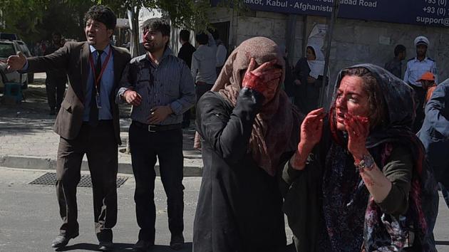 Wounded Afghan women seen at the site of a car bomb attack in Kabul . (SHAH MARAI / AFP)