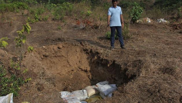 Officials dug six 4-foot-deep pits. Five to six shells were put in each pit, which was then covered with soil and pebbles. (Praful Gangurde / HT )