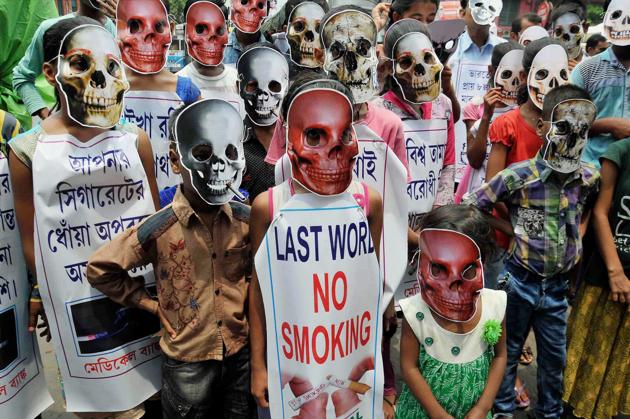 Children wear mask during an awareness campaign on 'World No Tobacco Day' in Kolkata on Wednesday. (PTI) Children wear mask during an awareness campaign on 'World No Tobacco Day' in Kolkata on Wednesday. (PTI)