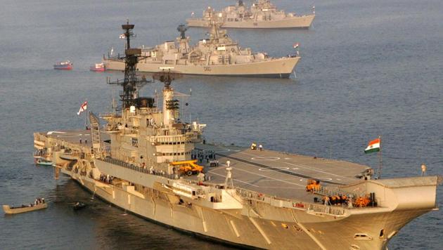 The Indian Navy's aircraft carrier Viraat anchored alongside other ships ahead of a fleet review in Visakhapatnam in February 2006.(Reuters File Photo)