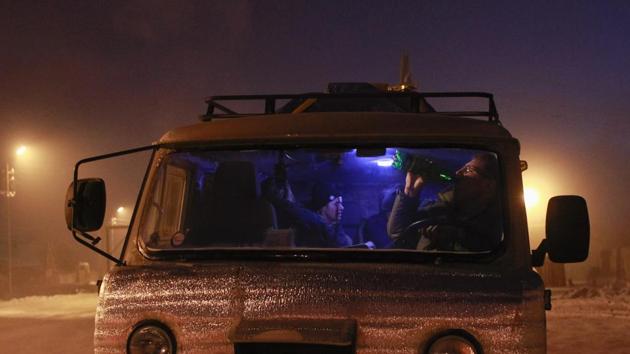 A man takes a drink in the cabin of his truck in the village of Ytyk-Kyuyol in the Republic of Sakha. (Maxim Shemetov / REUTERS) A man takes a drink in the cabin of his truck in the village of Ytyk-Kyuyol in the Republic of Sakha. (Maxim Shemetov / REUTERS)