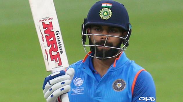 India's captain Virat Kohli celebrates his half century during the ICC Champions Trophy warm-up match against New Zealand.(AFP)