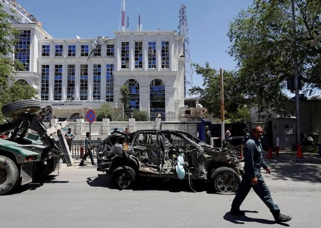 An Afghan policeman past walked next to a damaged vehicle after a blast in Kabul, Afghanistan. (Reuters Photo) An Afghan policeman past walked next to a damaged vehicle after a blast in Kabul, Afghanistan. (Reuters Photo)