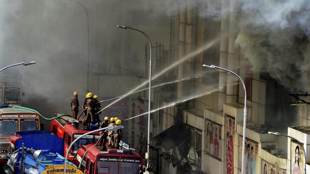 Fire personnel dousing the massive fire that broke out at Chennai Silks in T Nagar on Wednesday. (PTI) Fire personnel dousing the massive fire that broke out at Chennai Silks in T Nagar on Wednesday. (PTI)