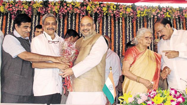 BJP President Amit Shah greeting Goa CM Manohar Parrikar during the swearing in ceremony on March 14, 2017. (L to R) Ramakrishna Dhavlikar, Union Minister Nitin Gadkari, Venkaiah Naidu, Governor Mridula Sinha are also seen. (HT Photo) BJP President Amit Shah greeting Goa CM Manohar Parrikar during the swearing in ceremony on March 14, 2017. (L to R) Ramakrishna Dhavlikar, Union Minister Nitin Gadkari, Venkaiah Naidu, Governor Mridula Sinha are also seen. (HT Photo)