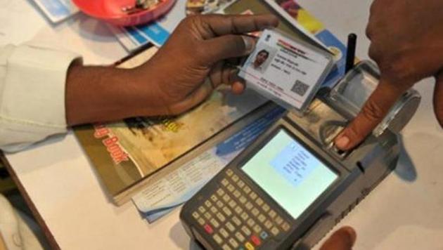 A man gives his thumb impression to withdraw money from his bank account using his Aadhaar number. (AFP File Photo) A man gives his thumb impression to withdraw money from his bank account using his Aadhaar number. (AFP File Photo)