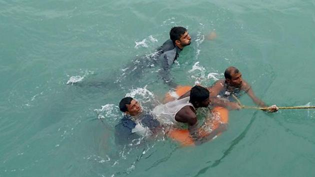 Bangladeshi nationals, who were found adrift at sea over 100 miles away from Chittagong due to Cyclone Mora, were rescued by the Indian Navy on Wednesday. (PTI Photo) Bangladeshi nationals, who were found adrift at sea over 100 miles away from Chittagong due to Cyclone Mora, were rescued by the Indian Navy on Wednesday. (PTI Photo)