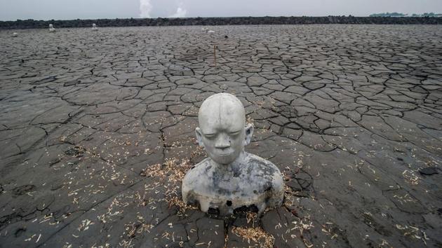A statue standing semi-submerged in mud, a symbol of the human toll of the 2006 disaster,in Sidoarjo. (JUNI KRISWANTO / AFP) A statue standing semi-submerged in mud, a symbol of the human toll of the 2006 disaster,in Sidoarjo. (JUNI KRISWANTO / AFP)