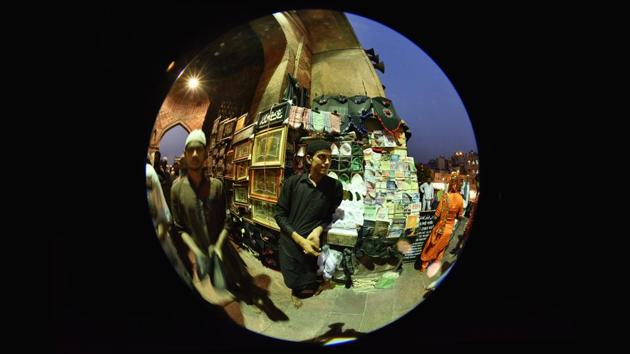 A Muslim man in his makeshift stall outside the Jama Masjid entry, selling Ramzan essentials. (Arun Sharma/HT PHOTO) 