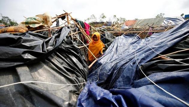 Rohingya refugee girl poses for a photograph in her house which has been destroyed by Cyclone Mora. Around 70 percent of the makeshift shacks in the refugee camp were damaged by the storm, which whipped through the region with winds of speed over 115 kms per hour. (Mohammad Ponir Hossain/REUTERS) Rohingya refugee girl poses for a photograph in her house which has been destroyed by Cyclone Mora. Around 70 percent of the makeshift shacks in the refugee camp were damaged by the storm, which whipped through the region with winds of speed over 115 kms per hour. (Mohammad Ponir Hossain/REUTERS)