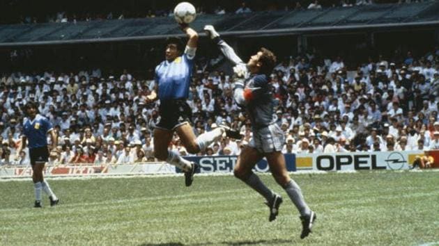 Diego Maradona (L) scores the infamous ‘Hand of God’ goal past England goalkeeper Peter Shilton at the 1986 World Cup. (Bob Thomas/Getty Images) Diego Maradona (L) scores the infamous ‘Hand of God’ goal past England goalkeeper Peter Shilton at the 1986 World Cup. (Bob Thomas/Getty Images)