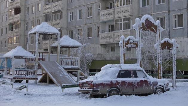 A car covered in ice is pictured near a playground . (Maxim Shemetov / REUTERS) A car covered in ice is pictured near a playground . (Maxim Shemetov / REUTERS)