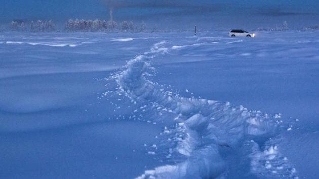 A car drives through the snow at night near Vostochnaya meteorological station, some 500 km northeast of Yakutsk . Locals keep their cars running all day for fear of them not starting again if turned off. (Maxim Shemetov / REUTERS) A car drives through the snow at night near Vostochnaya meteorological station, some 500 km northeast of Yakutsk . Locals keep their cars running all day for fear of them not starting again if turned off. (Maxim Shemetov / REUTERS)
