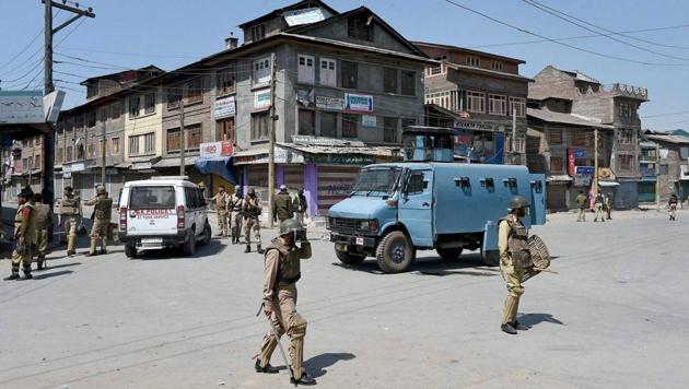 Police and CRPF personnel stand guard in Batamaloo area of Srinagar on May 16, 2017. (PTI) Police and CRPF personnel stand guard in Batamaloo area of Srinagar on May 16, 2017. (PTI)