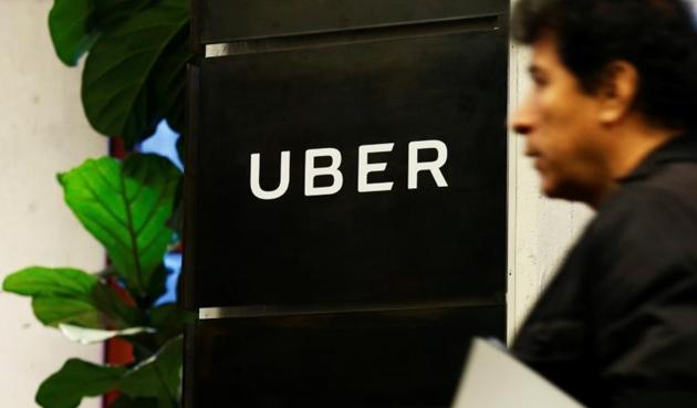 A man exits the Uber offices in Queens, New York. (Reuters) A man exits the Uber offices in Queens, New York. (Reuters)