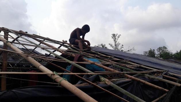 A Rohingya refugee works on rebuilding his house, which was destroyed as a result of the cyclone. (AFP) A Rohingya refugee works on rebuilding his house, which was destroyed as a result of the cyclone. (AFP)