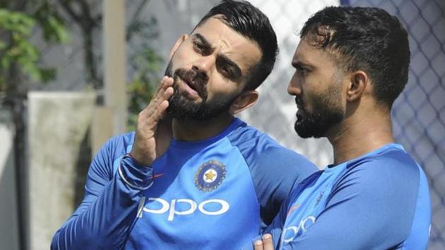 Virat Kohli in discussion with Dinesh Karthik (R) during the practice session. (AP) Virat Kohli in discussion with Dinesh Karthik (R) during the practice session. (AP)