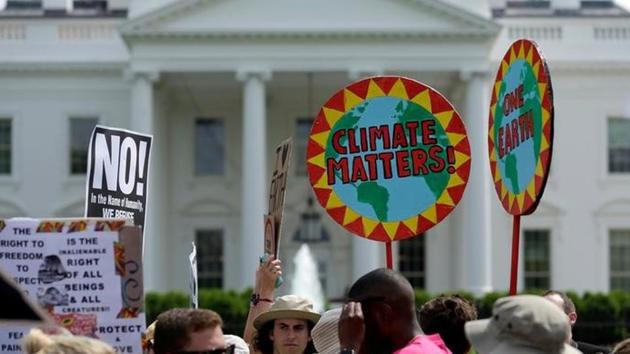 Protesters carry signs during the Peoples Climate March at the White House in Washington. (Reuters File Photo) Protesters carry signs during the Peoples Climate March at the White House in Washington. (Reuters File Photo)
