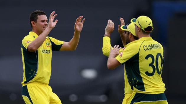 Australia's Josh Hazlewood (L) picked up six wickets against New Zealand in the ICC Champions Trophy Group A game at Edgbaston in Birmingham on Friday. Catch full cricket score of Australia vs New Zealand here.(AFP)
