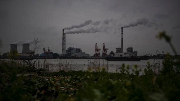 This file photo taken on February 21, 2017 shows the Huangpu river and the Wujing Coal-Electricity Power Station in Shanghai. Beijing vowed on June 2, 2017 to uphold the Paris climate accord after the United States withdrew from the pact, saying it was a "responsibility shouldered by China as a responsible major country". (AFP) This file photo taken on February 21, 2017 shows the Huangpu river and the Wujing Coal-Electricity Power Station in Shanghai. Beijing vowed on June 2, 2017 to uphold the Paris climate accord after the United States withdrew from the pact, saying it was a "responsibility shouldered by China as a responsible major country". (AFP)