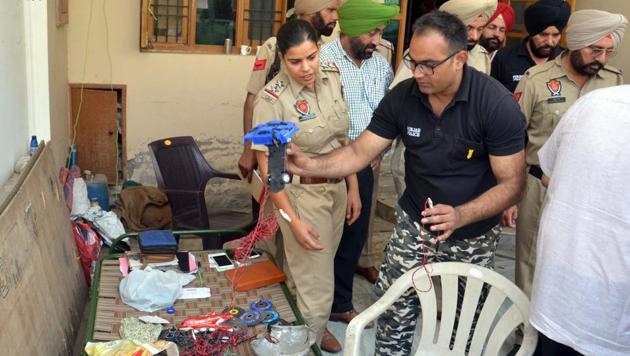 A bomb squad and cops checking material allegedly meant to make explosives at Rajatvir Singh Sodhi’s house in Patiala on Friday, June 2. (Bharat Bhushan/HT) A bomb squad and cops checking material allegedly meant to make explosives at Rajatvir Singh Sodhi’s house in Patiala on Friday, June 2. (Bharat Bhushan/HT)