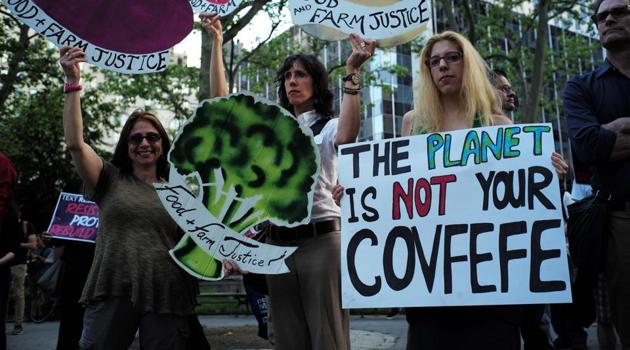 Environmental activists and supporters display placards during a demonstration in New York, to protest US President Donald Trump's decision to pull out of the 195-nation Paris climate accord deal. (AFP Photo) Environmental activists and supporters display placards during a demonstration in New York, to protest US President Donald Trump's decision to pull out of the 195-nation Paris climate accord deal. (AFP Photo)