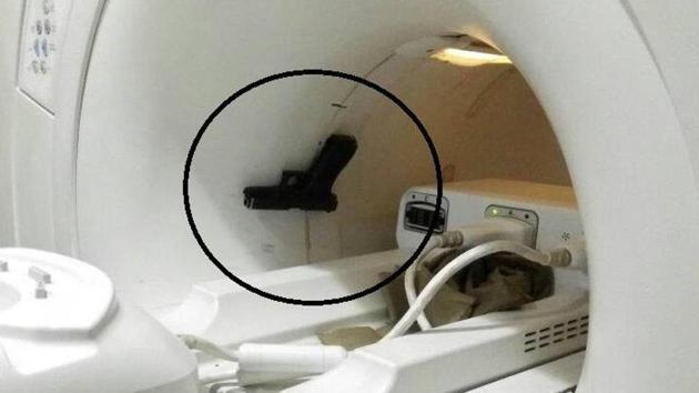 A pistol stuck inside an MRI machine at Ram Manohar Lohia hospital in Lucknow.(Twitter/ ANI Photo)