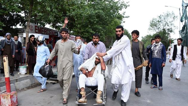 Afghan relatives push the wheelchair of a wounded man outside an Italian aid organization's hospital following a series of explosions that targeted a funeral of a politician's son, who was killed during an anti-government protest a day earlier, in Kabul on June 3, 2017.(AFP Photo) Afghan relatives push the wheelchair of a wounded man outside an Italian aid organization's hospital following a series of explosions that targeted a funeral of a politician's son, who was killed during an anti-government protest a day earlier, in Kabul on June 3, 2017.(AFP Photo)