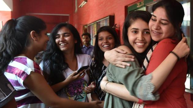Students of St Thomas school celebrating after the CBSE class 10 results were announced on June 3.(PTI Photo)
