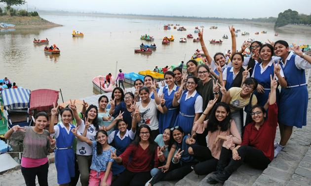 CBSE Class 10 students celebrating after the declaration of results at Sukhna lake in Chandigarh on Saturday. (Anil Dayal/HT Photo)