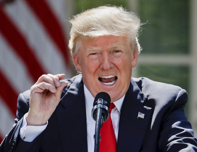 Donald Trump announcing that he will pull the US out of the Paris climate change accord on Thursday. (AP) Donald Trump announcing that he will pull the US out of the Paris climate change accord on Thursday. (AP)