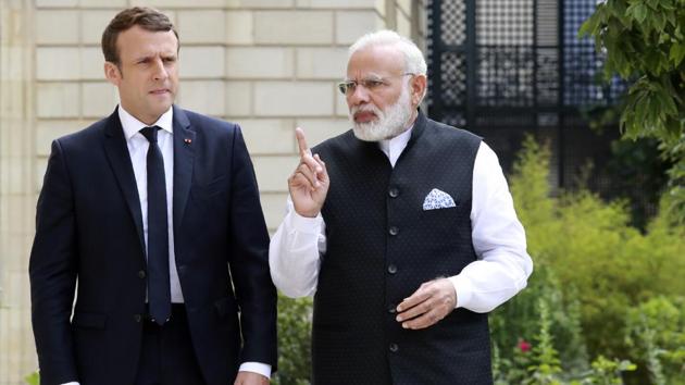 Prime Minister Narendra Modi (R) speaks with French President Emmanuel Macron in the garden of the Elysee Palace following their meeting in Paris, France, June 3. (REUTERS) Prime Minister Narendra Modi (R) speaks with French President Emmanuel Macron in the garden of the Elysee Palace following their meeting in Paris, France, June 3. (REUTERS)