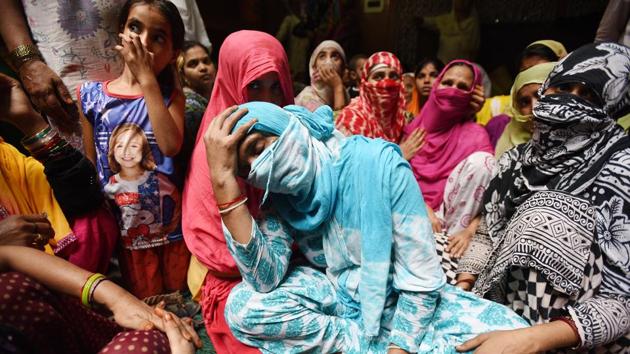 Relatives of Shakeel who shot dead by armed assailants at Jewar, in Greater Noida. A few people from Jevar were compelled to venture out late at night since they were tending to a lady relative who had been hospitalised. On the way, goons robbed them and dragged the women from the family into the fields and gang raped them. The male relative, Shakeel, who resisted was shot dead.. (Virendra Singh Gosain/HT PHOTO) Relatives of Shakeel who shot dead by armed assailants at Jewar, in Greater Noida. A few people from Jevar were compelled to venture out late at night since they were tending to a lady relative who had been hospitalised. On the way, goons robbed them and dragged the women from the family into the fields and gang raped them. The male relative, Shakeel, who resisted was shot dead.. (Virendra Singh Gosain/HT PHOTO)