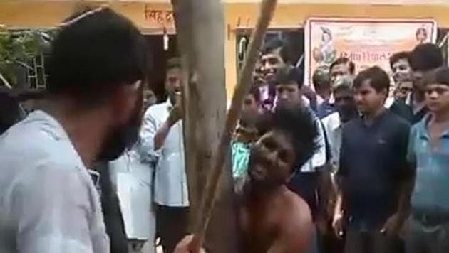 Onlookers recorded the incident, while some joined the assaulters.(VIDEO GRAB)