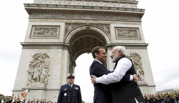 Indian Prime Minister Narendra Modi hugs French President Emmanuel Macron, centre as they attend a ceremony at the Arc de Triomphe in Paris, France, Saturday, June 3, 2017. (AP Photo) Indian Prime Minister Narendra Modi hugs French President Emmanuel Macron, centre as they attend a ceremony at the Arc de Triomphe in Paris, France, Saturday, June 3, 2017. (AP Photo)