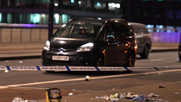 Debris and abandoned cars remain on London at the scene of an apparent terror attack in central London on June 3, 2017. Armed police fired shots after reports of stabbings and a van hitting pedestrians on London Bridge on Saturday in an incident reminiscent of a terror attack in March just days ahead of a general election. (AFP) Debris and abandoned cars remain on London at the scene of an apparent terror attack in central London on June 3, 2017. Armed police fired shots after reports of stabbings and a van hitting pedestrians on London Bridge on Saturday in an incident reminiscent of a terror attack in March just days ahead of a general election. (AFP)