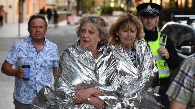 A police officer escorts members of the public, wrapped in foil blankets, towards The Shard in London on June 4, 2017, following a terror attack. Forty-eight people have been taken to hospital after a terror attack in central London in which six people died, the London Ambulance Service said Sunday. (AFP) A police officer escorts members of the public, wrapped in foil blankets, towards The Shard in London on June 4, 2017, following a terror attack. Forty-eight people have been taken to hospital after a terror attack in central London in which six people died, the London Ambulance Service said Sunday. (AFP)