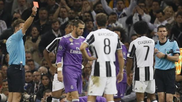 Juventus' Juan Cuadrado was harshly sent off for a nudge on Sergio Ramos. (AP) Juventus' Juan Cuadrado was harshly sent off for a nudge on Sergio Ramos. (AP)
