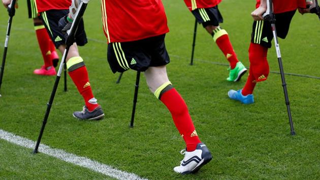Football Soccer - Belgium's national soccer team training - King Baudouin stadium, Brussels, Belgium - 3/6/17 - Members of the Belgian disabled soccer team walk on the pitch during a training session of the Belgian national squad. (Francois Lenoir / REUTERS) Football Soccer - Belgium's national soccer team training - King Baudouin stadium, Brussels, Belgium - 3/6/17 - Members of the Belgian disabled soccer team walk on the pitch during a training session of the Belgian national squad. (Francois Lenoir / REUTERS)