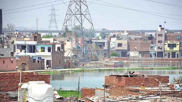 Water bodies and ponds are encroached upon by various agencies, including government authorities, in Ghaziabad.(Sakib Ali/HT Photo)