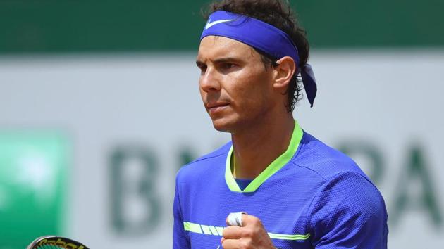 Spain's Rafael Nadal celebrates after winning his 4th round match against Spain's Roberto Bautista Agut at the Roland Garros 2017 French Open on Sunday.(AFP)