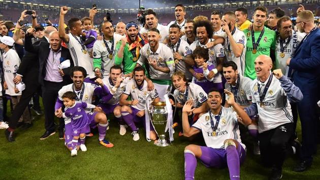 Real Madrid poses with the trophy after winning the UEFA Champions League final football match between Juventus and Real Madrid at The Principality Stadium in Cardiff, south Wales. (Glyn KIRK / AFP) Real Madrid poses with the trophy after winning the UEFA Champions League final football match between Juventus and Real Madrid at The Principality Stadium in Cardiff, south Wales. (Glyn KIRK / AFP)
