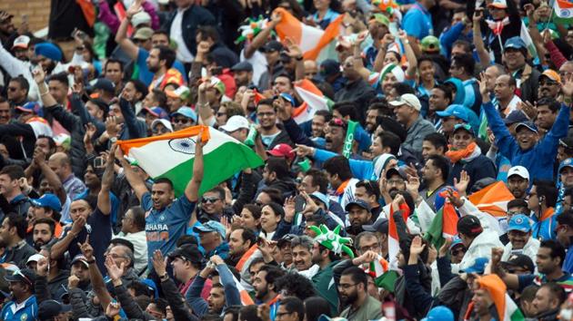 Indian cricket fans cheer and wave national flags during the ICC Champions trophy match between India and Pakistan. (AFP) Indian cricket fans cheer and wave national flags during the ICC Champions trophy match between India and Pakistan. (AFP)
