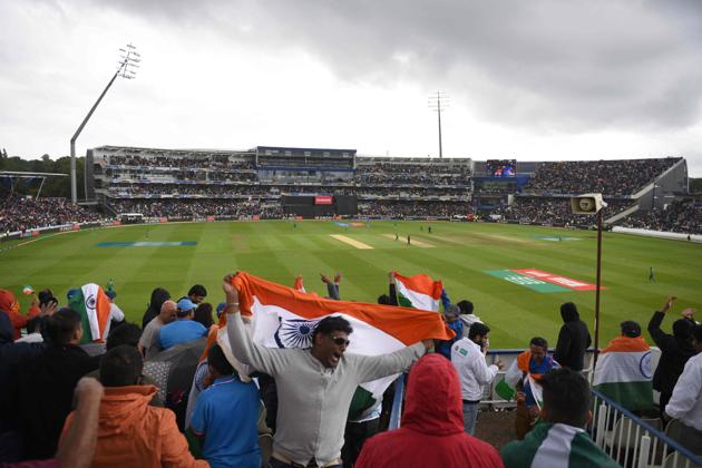 Indian cricket fans wave the national flag during the ICC Champions trophy match between India and Pakistan. (AFP) Indian cricket fans wave the national flag during the ICC Champions trophy match between India and Pakistan. (AFP)