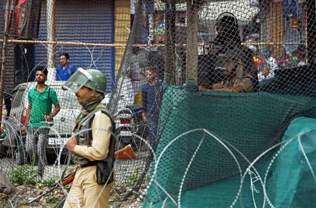 Security personnel keep vigil from a temporary bunker in Srinagar following the killing of four heavily armed militants who had tried to storm a CRPF camp in a pre-dawn suicide attack in Bandipora district of Jammu and Kashmir on Monday. (PTI Photo) Security personnel keep vigil from a temporary bunker in Srinagar following the killing of four heavily armed militants who had tried to storm a CRPF camp in a pre-dawn suicide attack in Bandipora district of Jammu and Kashmir on Monday. (PTI Photo)