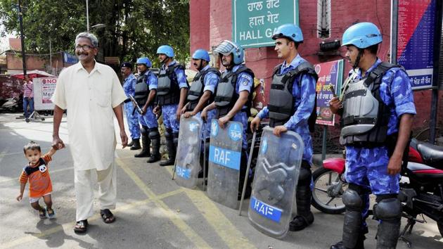 Rapid Action Force (RAF) personnel stand guard on the eve of Operation Bluestar anniversary in Amritsar on Monday. (PTI) Rapid Action Force (RAF) personnel stand guard on the eve of Operation Bluestar anniversary in Amritsar on Monday. (PTI)