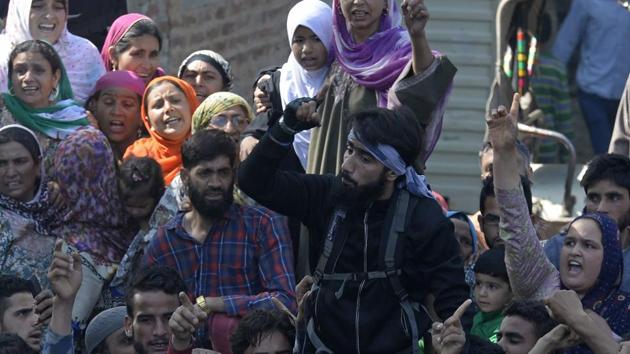 A rebel (in black) shouts slogans during the funeral of rebel commander Sabzar Ahmad Bhat in Rathsuna Tral, near Srinagar.(AFP File Photo) A rebel (in black) shouts slogans during the funeral of rebel commander Sabzar Ahmad Bhat in Rathsuna Tral, near Srinagar.(AFP File Photo)