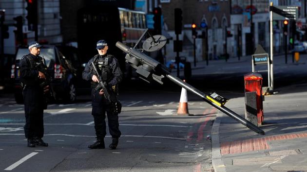 Armed police officers stand near the site where attackers crashed their van after running over pedestrians.British Prime Minister Theresa May called on Sunday for a stronger response to Islamist extremism. (Peter Nicholls/REUTERS) Armed police officers stand near the site where attackers crashed their van after running over pedestrians.British Prime Minister Theresa May called on Sunday for a stronger response to Islamist extremism. (Peter Nicholls/REUTERS)